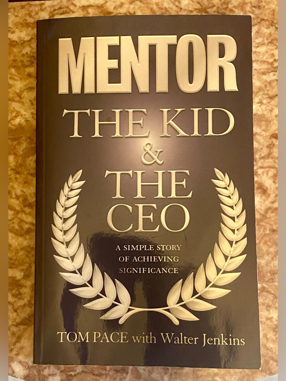 MENTOR: The Kid & The CEO by Tom Pace - Black & Gold Paperback.